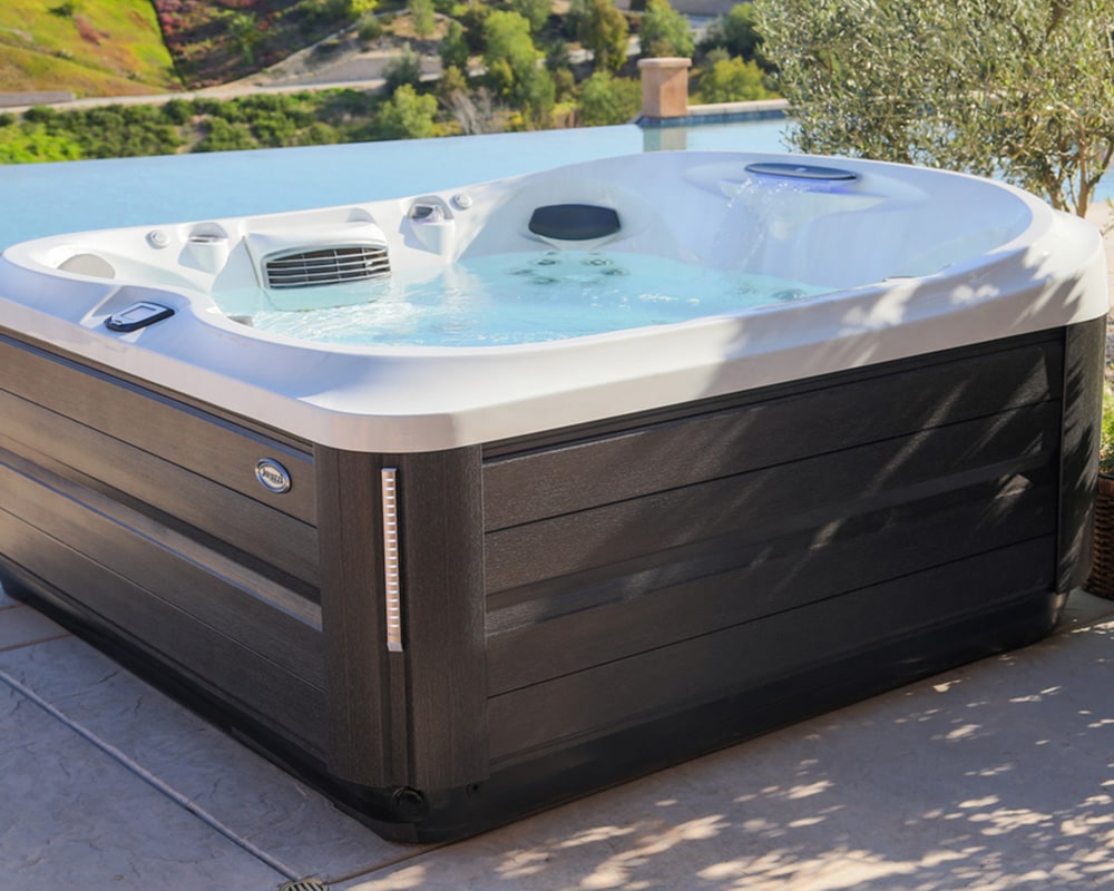 outdoor hot tub with a view, featuring modern design
